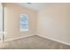 Cozy room with natural light from window, neutral walls and plush carpeting creating a calming space at 8305 Chapelle Ct, Las Vegas, NV 89131