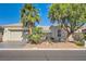 Charming single-story home with desert landscaping, palm trees, stone accents, and a two-car garage at 8305 Chapelle Ct, Las Vegas, NV 89131