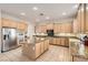Well-lit kitchen with stainless appliances, granite countertops, and a center island for food preparation at 8305 Chapelle Ct, Las Vegas, NV 89131