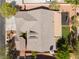 An aerial view of the home shows the backyard landscaping including a play area and shade at 8504 Mystic Night Ave, Las Vegas, NV 89143