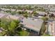 Overhead shot of the backyard with covered patio and view of the houses and neighborhood at 8504 Mystic Night Ave, Las Vegas, NV 89143