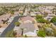 Aerial view of homes in a residential community, highlighting the surrounding greenery and neighborhood layout at 8504 Mystic Night Ave, Las Vegas, NV 89143