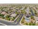 Aerial of a desert community shows many single Gathering homes and manicured streets at 8504 Mystic Night Ave, Las Vegas, NV 89143