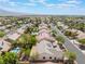 Beautiful community aerial view features a single-story home with covered patio, backyard, and mature trees at 8504 Mystic Night Ave, Las Vegas, NV 89143