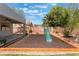 Backyard featuring a spacious patio, playset area, and well-maintained landscaping for outdoor living at 8504 Mystic Night Ave, Las Vegas, NV 89143