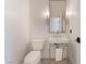 Elegant powder room with a decorative mirror, stylish lighting, and modern fixtures at 8504 Mystic Night Ave, Las Vegas, NV 89143