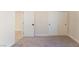 Neutral carpeted bedroom with a closet and an open doorway to another room at 8504 Mystic Night Ave, Las Vegas, NV 89143