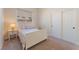 Cozy bedroom with carpet, a full bed, side table, and double-door closet at 8504 Mystic Night Ave, Las Vegas, NV 89143
