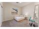 Neutral bedroom with carpet, a daybed, desk, and sliding closet door at 8504 Mystic Night Ave, Las Vegas, NV 89143