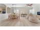 Bright dining area with modern lighting, bean bag chairs, and light wood flooring at 8504 Mystic Night Ave, Las Vegas, NV 89143