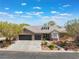 Inviting aerial view of a landscaped home with a three-car garage and manicured front yard at 8504 Mystic Night Ave, Las Vegas, NV 89143