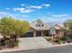 Beautiful aerial view of a two-story home with well-kept landscaping and a three-car garage at 8504 Mystic Night Ave, Las Vegas, NV 89143