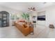 Spacious living room features modern decor, fireplace, and large windows for ample natural light at 8504 Mystic Night Ave, Las Vegas, NV 89143