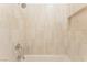 Tiled shower and tub combination with a shower head and a built in niche at 8504 Mystic Night Ave, Las Vegas, NV 89143