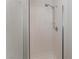 Bathroom featuring walk-in shower with glass doors and white tile surround at 8504 Mystic Night Ave, Las Vegas, NV 89143