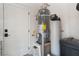 The utility room includes a water heater and water softener system behind a white door at 8504 Mystic Night Ave, Las Vegas, NV 89143