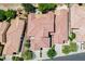 Drone view of a neighborhood with well manicured lawns and tile roofs at 8873 Briar Bay Dr, Las Vegas, NV 89131