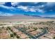 Panoramic aerial view of the community showcasing the desert landscape and surrounding mountains at 8873 Briar Bay Dr, Las Vegas, NV 89131