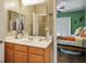 Well-lit bathroom featuring a single sink vanity and a view into the adjacent bedroom at 8873 Briar Bay Dr, Las Vegas, NV 89131