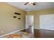 Bedroom with dark wood floors and decorative floating shelves at 8873 Briar Bay Dr, Las Vegas, NV 89131