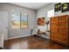 Bedroom with hardwood floors, and a decorative accent wall at 8873 Briar Bay Dr, Las Vegas, NV 89131