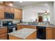 Well-equipped kitchen with granite countertops, stainless steel appliances, and ample cabinet space at 8873 Briar Bay Dr, Las Vegas, NV 89131