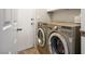 Convenient laundry area equipped with modern washer and dryer units, offering efficient functionality at 8873 Briar Bay Dr, Las Vegas, NV 89131