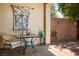 Outdoor patio with charming decor, a cozy seating area, and a decorative wall hanging at 8873 Briar Bay Dr, Las Vegas, NV 89131
