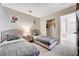 Shared bedroom featuring two twin beds with nightstand and closet at 9328 Jumpin Juniper Ave, Las Vegas, NV 89129