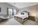 Inviting bedroom features a vaulted ceiling, large windows, and neutral decor at 9328 Jumpin Juniper Ave, Las Vegas, NV 89129