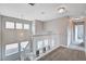 Upstairs hallway with neutral carpet features large windows and access to other rooms at 9328 Jumpin Juniper Ave, Las Vegas, NV 89129
