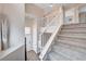Bright staircase features white railing, neutral paint, stylish decor and carpeted stairs at 9328 Jumpin Juniper Ave, Las Vegas, NV 89129