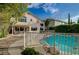Spacious backyard showcasing a pool and patio area, set against the backdrop of a well-maintained home at 9772 Galahad Point Ct, Las Vegas, NV 89147