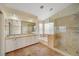 Bathroom featuring double sinks, a glass shower, and tub at 9772 Galahad Point Ct, Las Vegas, NV 89147