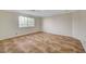 Bedroom featuring a large window and tiled floors at 9772 Galahad Point Ct, Las Vegas, NV 89147