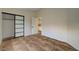 Bedroom with tile flooring and sliding door closet at 9772 Galahad Point Ct, Las Vegas, NV 89147