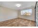 Bright bedroom with large window and tiled flooring at 9772 Galahad Point Ct, Las Vegas, NV 89147