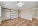 Bedroom featuring a walk-in closet, neutral walls and tiled floors at 9772 Galahad Point Ct, Las Vegas, NV 89147