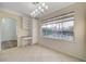 Cozy breakfast nook with pool view, built-in desk, and ample natural light at 9772 Galahad Point Ct, Las Vegas, NV 89147