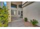 Welcoming front entrance with a decorative door and sidelight windows at 9772 Galahad Point Ct, Las Vegas, NV 89147