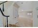 Hallway featuring neutral walls, tile floors and stairs leading to upper level at 9772 Galahad Point Ct, Las Vegas, NV 89147