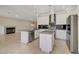 Modern kitchen featuring stainless steel appliances and a kitchen island at 9772 Galahad Point Ct, Las Vegas, NV 89147