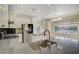 Spacious kitchen with stainless steel appliances, granite countertops, and backyard pool view at 9772 Galahad Point Ct, Las Vegas, NV 89147