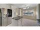 Bright kitchen featuring stainless steel appliances, island, and view of backyard pool at 9772 Galahad Point Ct, Las Vegas, NV 89147