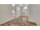 Open living space with high ceilings, tile flooring, columns, and lots of natural light at 9772 Galahad Point Ct, Las Vegas, NV 89147