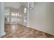 Spacious living room featuring high ceilings, tile flooring and large windows providing ample natural light at 9772 Galahad Point Ct, Las Vegas, NV 89147