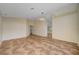 Open living room with tile flooring and modern light fixture at 9772 Galahad Point Ct, Las Vegas, NV 89147