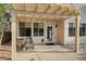 Inviting patio area with a pergola, providing a cozy spot for relaxation and outdoor enjoyment at 9772 Galahad Point Ct, Las Vegas, NV 89147