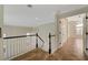 Upstairs hallway provides views of the foyer and access to bedrooms at 9772 Galahad Point Ct, Las Vegas, NV 89147