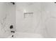 Close-up of marble-tiled shower with built-in niche and modern fixtures at 113 Elm St, Henderson, NV 89015